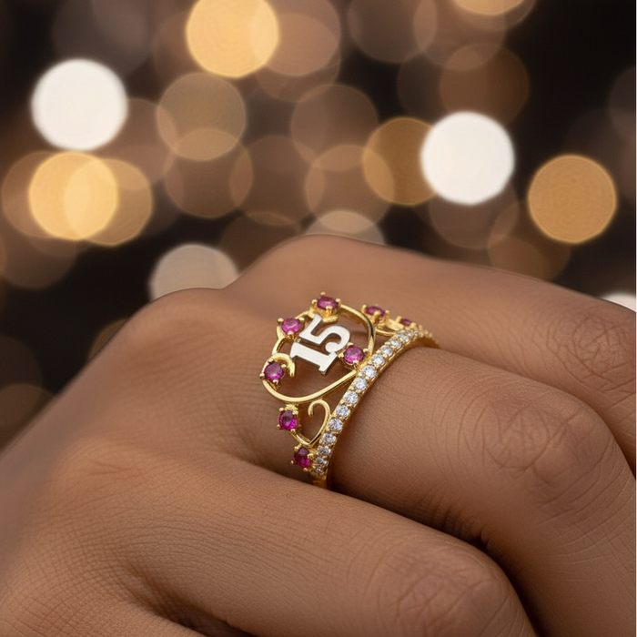 Gold ring with gemstones on a blurred background
