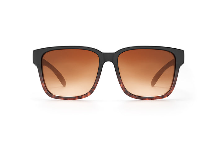 Front of Heat Wave Visual Apollo Sunglasses with black and tortoise brown frame and brown gradient lenses.