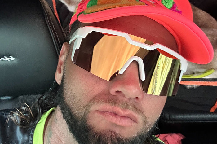 Man wearing the Future Tech Sunglasses: GLOSS WHITE Gold Lens Z87+