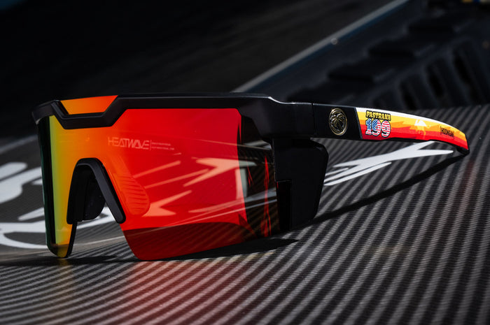 Lying on a carbon fiber wing is the Heat Wave Visual Future Tech Hoonigan Pastrana Sunglasses.