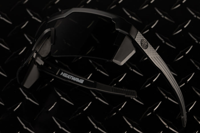 Heat Wave Visual Future Tech Sunglasses with black frame with SOCOM print arms and black lens.