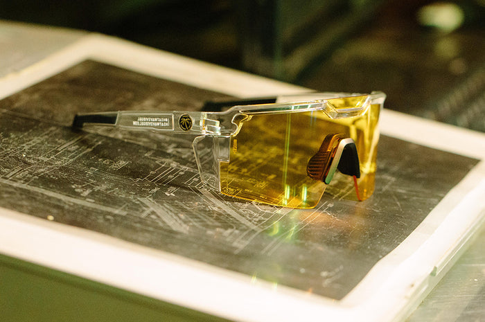 Side of Heat Wave Visual Future Tech Sunglasses with clear frame and hi vis yellow lens.