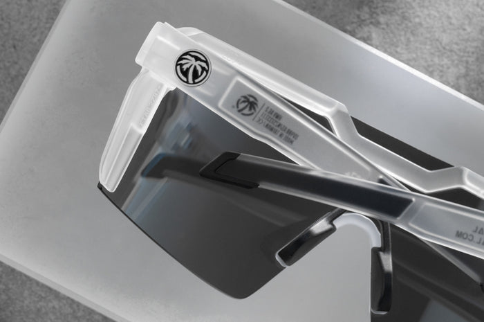 Close up backside shot of the Future Tech Sunglasses: Vapor Frost Frame Coastal Lens Z87+ with clear side shields on a concrete block.