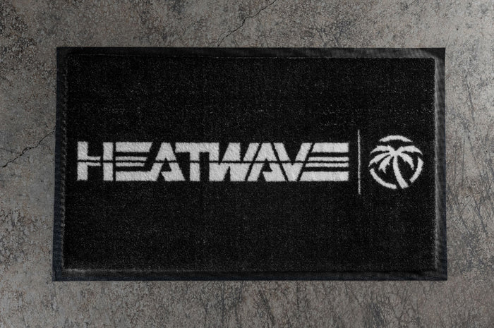 Heat Wave Visual Entryway Rug on a concrete floor.