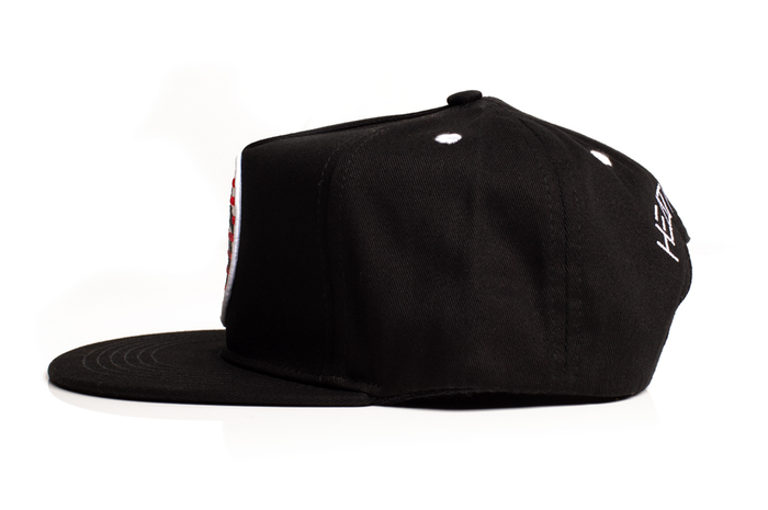 Side of Heat Wave Visual black snapback hat with USA icon patch.