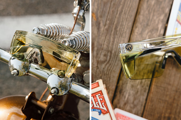 Front and backside of the Performance Lazer Face Sunglasses: Easy Rider Photochromic Z87+ on a wood table