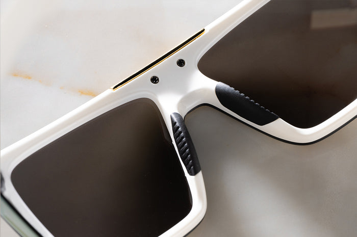 Close up shot of the backside of the Performance Quatro Sunglasses: GLOSS WHITE Gold Lens Z87+