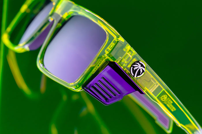 Close up shot of the Performance Rayth Sunglasses: Antifreeze Z87+  with side shields on a neon green platform