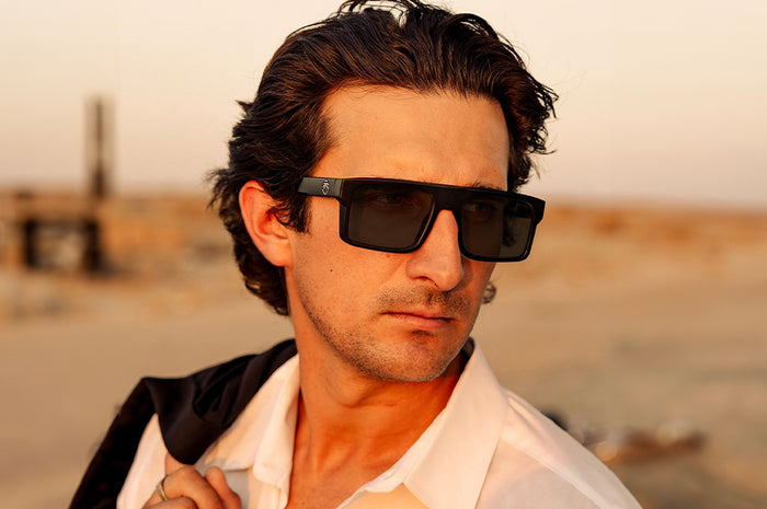 Man rocking the Heat Wave Visual Performance Rayth Super Photochromic Sunglasses.