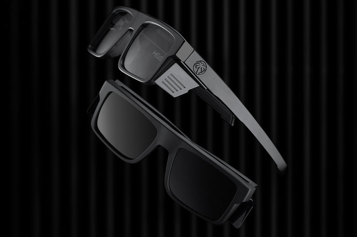Lying on the floor is the Heat Wave Visual Performance Rayth Super Photochromic Sunglasses.
