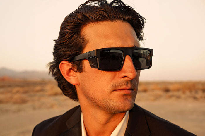 Young dude wearing the Heat Wave Visual Performance Rayth Ultra Black Sunglasses.