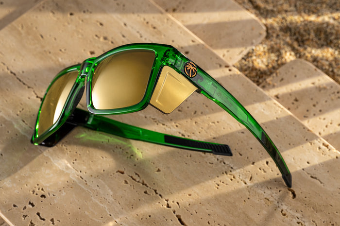 The Performance Vise Sunglasses: Cycad Green Z87+ with gold side shields on concrete