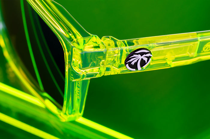 Close up shot of the Performance XL VISE Sunglasses Frame: Antifreeze Z87+ sitting on a neon green platform