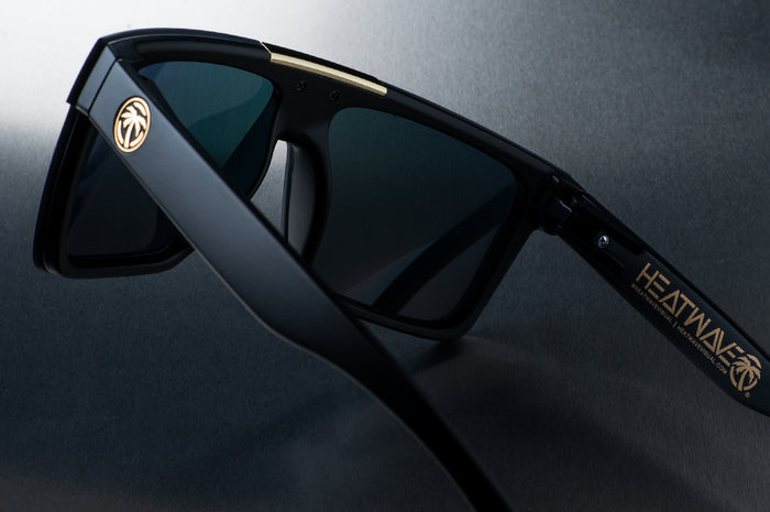 Rear view of Heat Wave Visual Quatro Sunglasses with black frame and sunblast orange yellow lens.