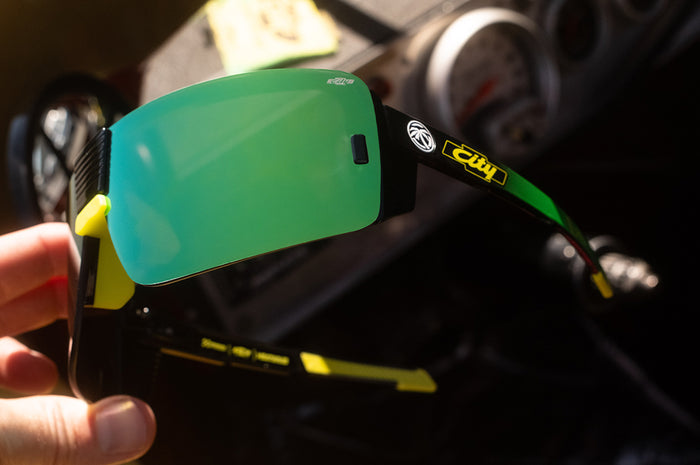 Someone holding the City of Chevrolet x HWV Vector Sunglasses.