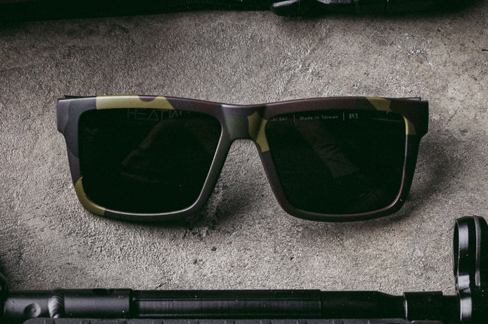 Close up of Heat Wave Visual Vise Z87 Sunglasses with fleck camo frame