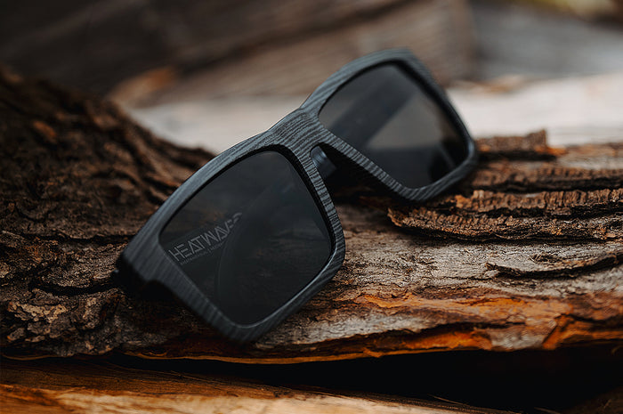 The XL VISE Z87 Sunglasses: Deadwood placed on a log