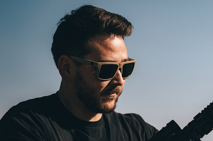 Man wearing the XL VISE Z87 Sunglasses DESERT TAN: Black